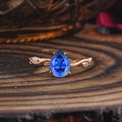 Nature-Inspired Classic 4-Prong Pear-Cut Sapphire Engagement Ring