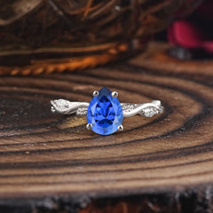 Nature-Inspired Classic 4-Prong Pear-Cut Sapphire Engagement Ring