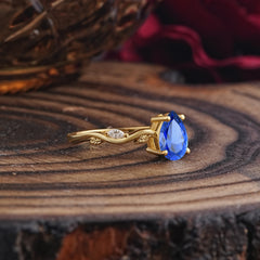 Nature-Inspired Classic 4-Prong Pear-Cut Sapphire Engagement Ring