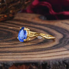 Nature-Inspired Classic 4-Prong Pear-Cut Sapphire Engagement Ring