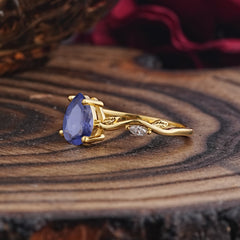 Nature-Inspired Classic 4-Prong Pear-Cut Tanzanite Engagement Ring