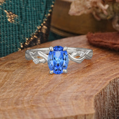 Artistic Twisted Shank Oval Cut Sapphire Engagement Ring