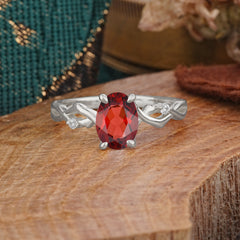 Artistic Twisted Shank Oval Cut Garnet Engagement Ring