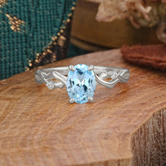 Artistic Twisted Shank Oval Cut Aquamarine Engagement Ring