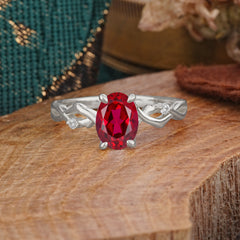 Artistic Twisted Shank Oval Cut Ruby Engagement Ring