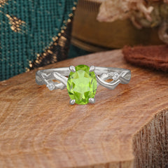 Artistic Twisted Shank Oval Cut Peridot Engagement Ring