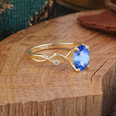 Artistic Twisted Shank Oval Cut Sapphire Engagement Ring