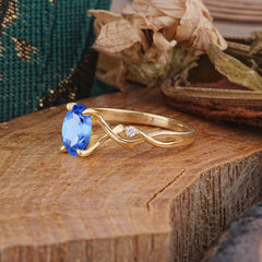 Artistic Twisted Shank Oval Cut Sapphire Engagement Ring