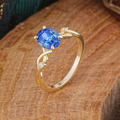 Artistic Twisted Shank Oval Cut Sapphire Engagement Ring