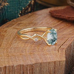 Artistic Twisted Shank Oval Cut Moss Agate Engagement Ring