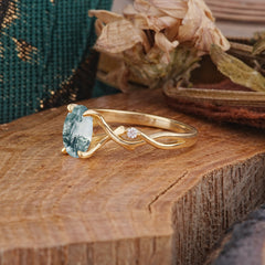 Artistic Twisted Shank Oval Cut Moss Agate Engagement Ring