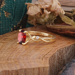 Artistic Twisted Shank Oval Cut Garnet Engagement Ring