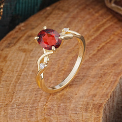Artistic Twisted Shank Oval Cut Garnet Engagement Ring