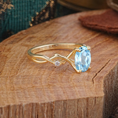 Artistic Twisted Shank Oval Cut Aquamarine Engagement Ring