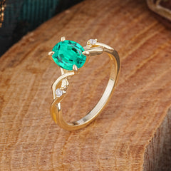 Artistic Twisted Shank Oval Cut Emerald Engagement Ring