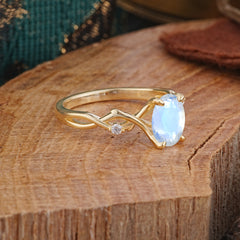 Artistic Twisted Shank Oval Cut Moonstone Engagement Ring