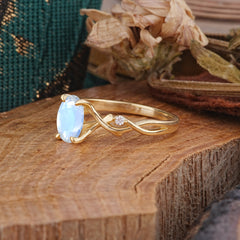 Artistic Twisted Shank Oval Cut Moonstone Engagement Ring