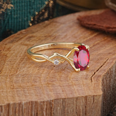 Artistic Twisted Shank Oval Cut Ruby Engagement Ring