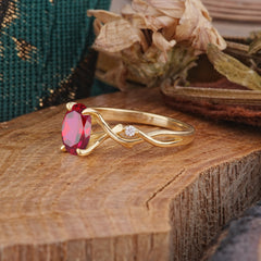 Artistic Twisted Shank Oval Cut Ruby Engagement Ring