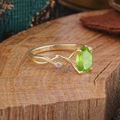 Artistic Twisted Shank Oval Cut Peridot Engagement Ring