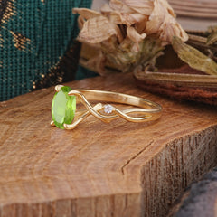 Artistic Twisted Shank Oval Cut Peridot Engagement Ring
