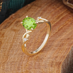 Artistic Twisted Shank Oval Cut Peridot Engagement Ring
