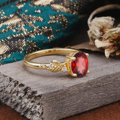 4 Prong Oval Garnet Gold Ring for Timeless Love