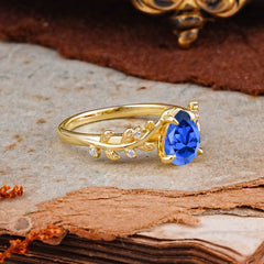 Nature-Inspired Vine-Entwined 4-Prong Teardrop-Cut Sapphire Engagement Ring