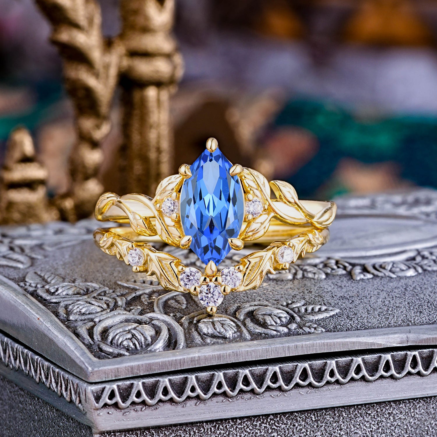 Nature-Inspired 6 Prong Marquise Sapphire Bridal Ring Set with Vine Motif
