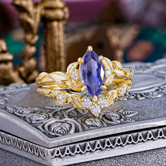 Nature-Inspired 6 Prong Marquise Tanzanite Engagement Ring Set with Vine Motif