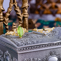 Nature-Inspired 6 Prong Marquise Peridot Engagement Ring Set with Vine Motif