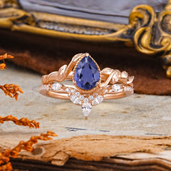 Nature-Inspired 3-Prong Oval-Cut Natural Tanzanite Engagement Ring Set With Vine Accents