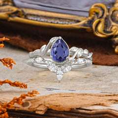 Nature-Inspired 3-Prong Oval-Cut Natural Tanzanite Engagement Ring Set With Vine Accents