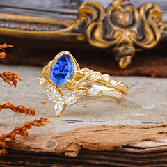 Nature-Inspired 3-Prong Oval-Cut Sapphire Engagement Ring Set with Vine Accents