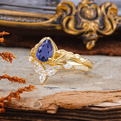 Nature-Inspired 3-Prong Oval-Cut Natural Tanzanite Engagement Ring Set With Vine Accents