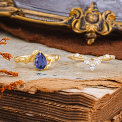 Nature-Inspired 3-Prong Oval-Cut Natural Tanzanite Engagement Ring Set With Vine Accents