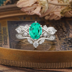 The Sumptuous Oval - Cut Emerald Halo Ring