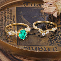 The Sumptuous Oval - Cut Emerald Halo Ring