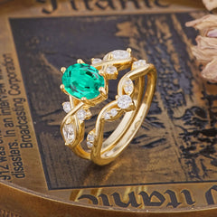 The Sumptuous Oval - Cut Emerald Halo Ring