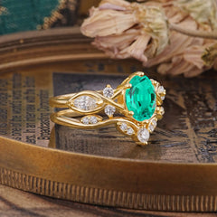 The Sumptuous Oval - Cut Emerald Halo Ring