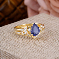 Luxurious Vintage-Inspired 4-Prong Pear-Cut Tanzanite Engagement Ring Set