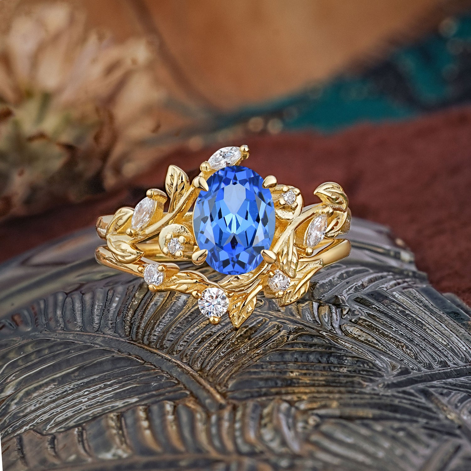 1.15 CT Delicate Leaf Accented 4 Prong Oval Shaped Sapphire Bridal Ring Set