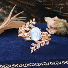 Delicate Leaf Embellished 4 - Prong Oval - Cut Moonstone Ring Sets
