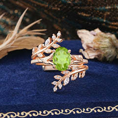 Delicate Leaf Embellished 4 - Prong Oval - Cut Peridot Ring Sets