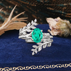 Delicate Leaf Embellished 4 - Prong Oval - Cut Emerald Ring Sets