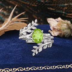 Delicate Leaf Embellished 4 - Prong Oval - Cut Peridot Ring Sets