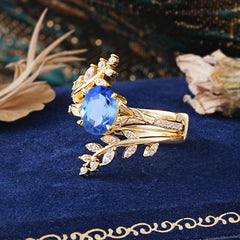 Delicate Leaf Embellished 4 - Prong Oval - Cut Sapphire Ring Sets