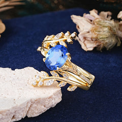 Delicate Leaf Embellished 4 - Prong Oval - Cut Sapphire Ring Sets