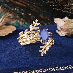 Delicate Leaf Embellished 4 - Prong Oval - Cut Tanzanite Ring Sets