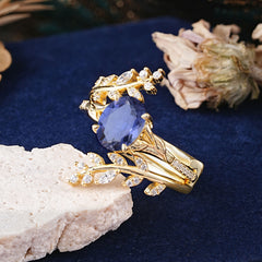 Delicate Leaf Embellished 4 - Prong Oval - Cut Tanzanite Ring Sets